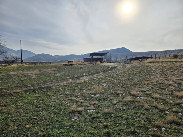 View of mountain background featuring rural landscape