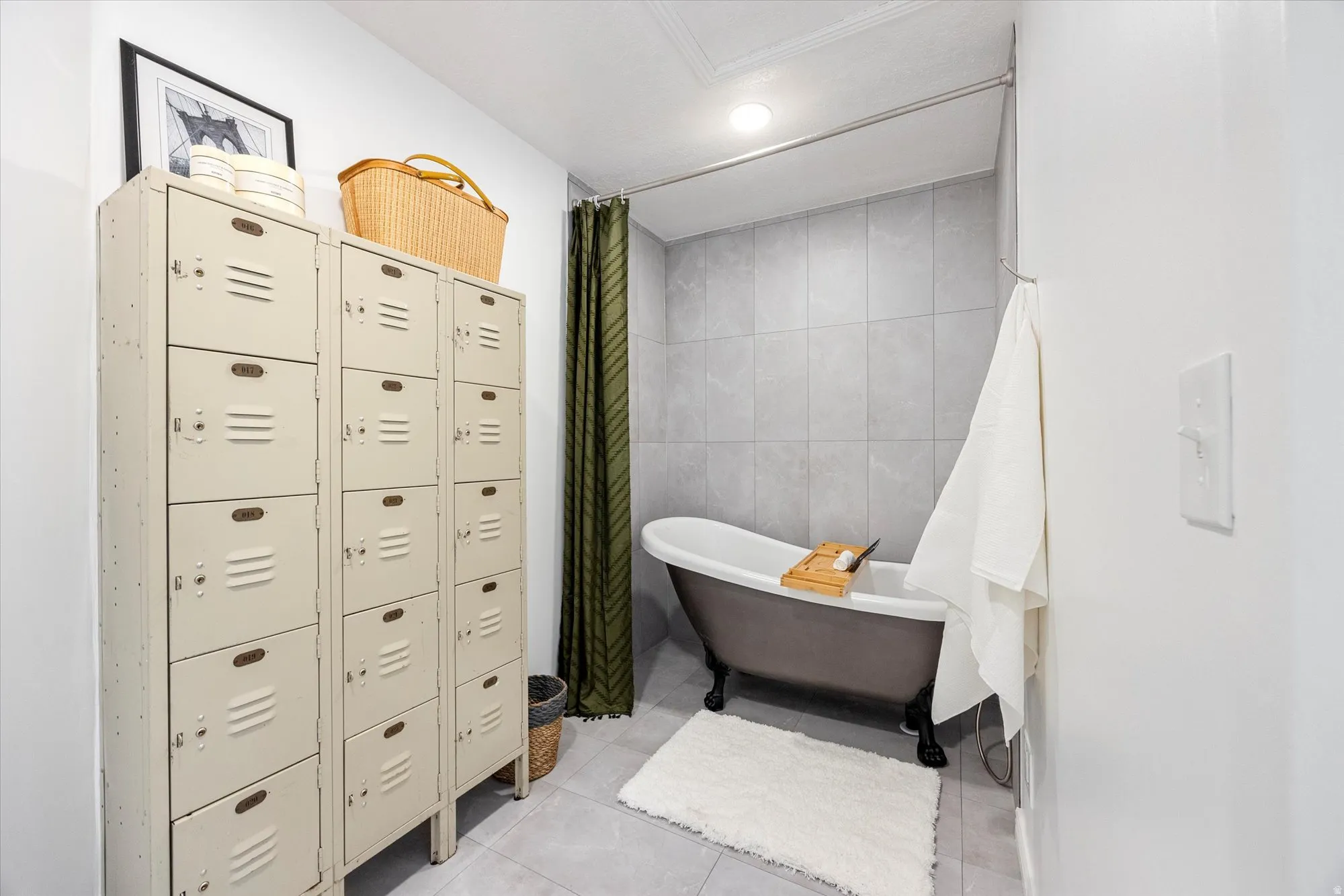 Full bathroom with tile walls, a freestanding bath, light tile patterned floors, and recessed lighting