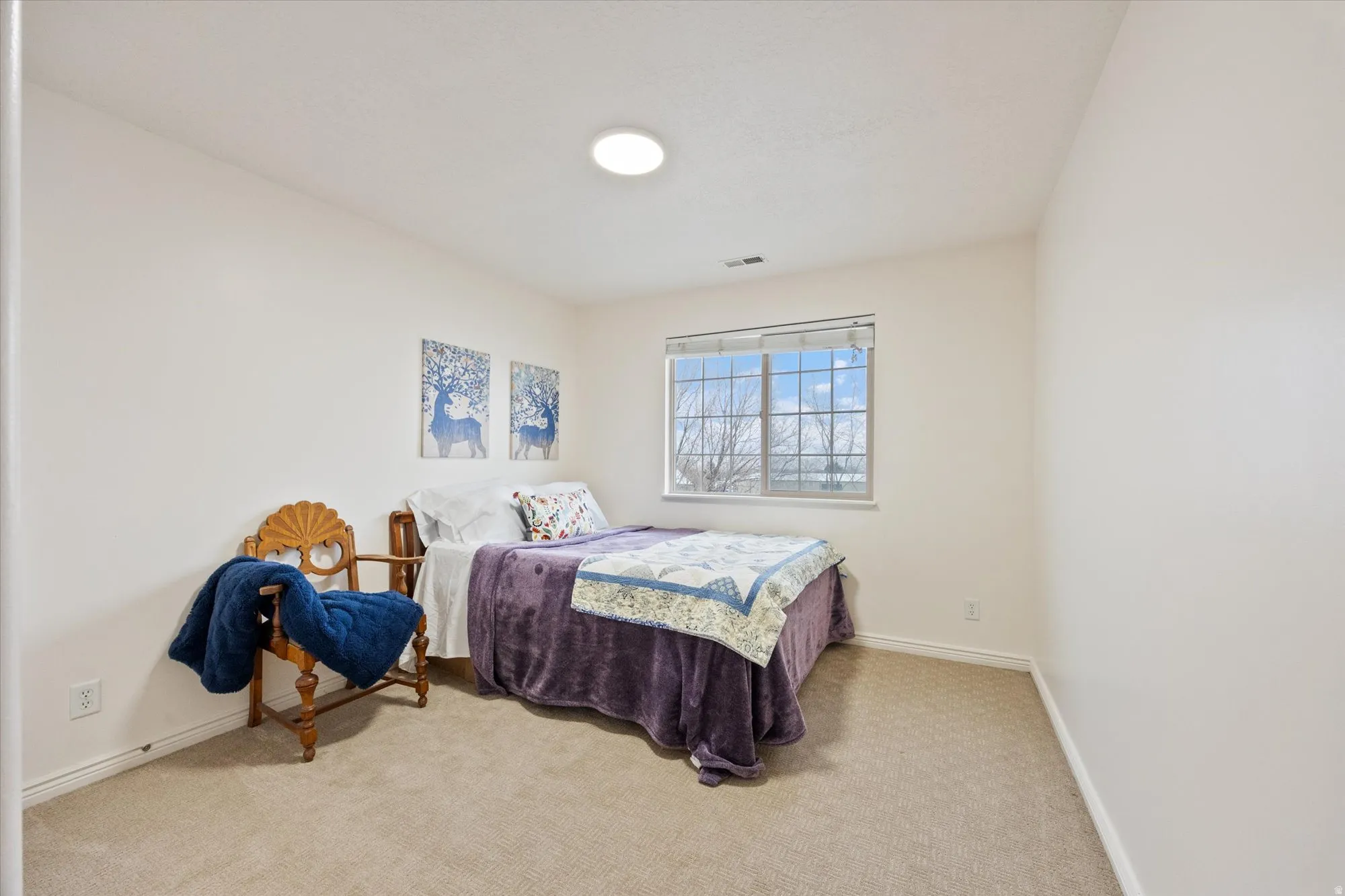 Carpeted bedroom with baseboards