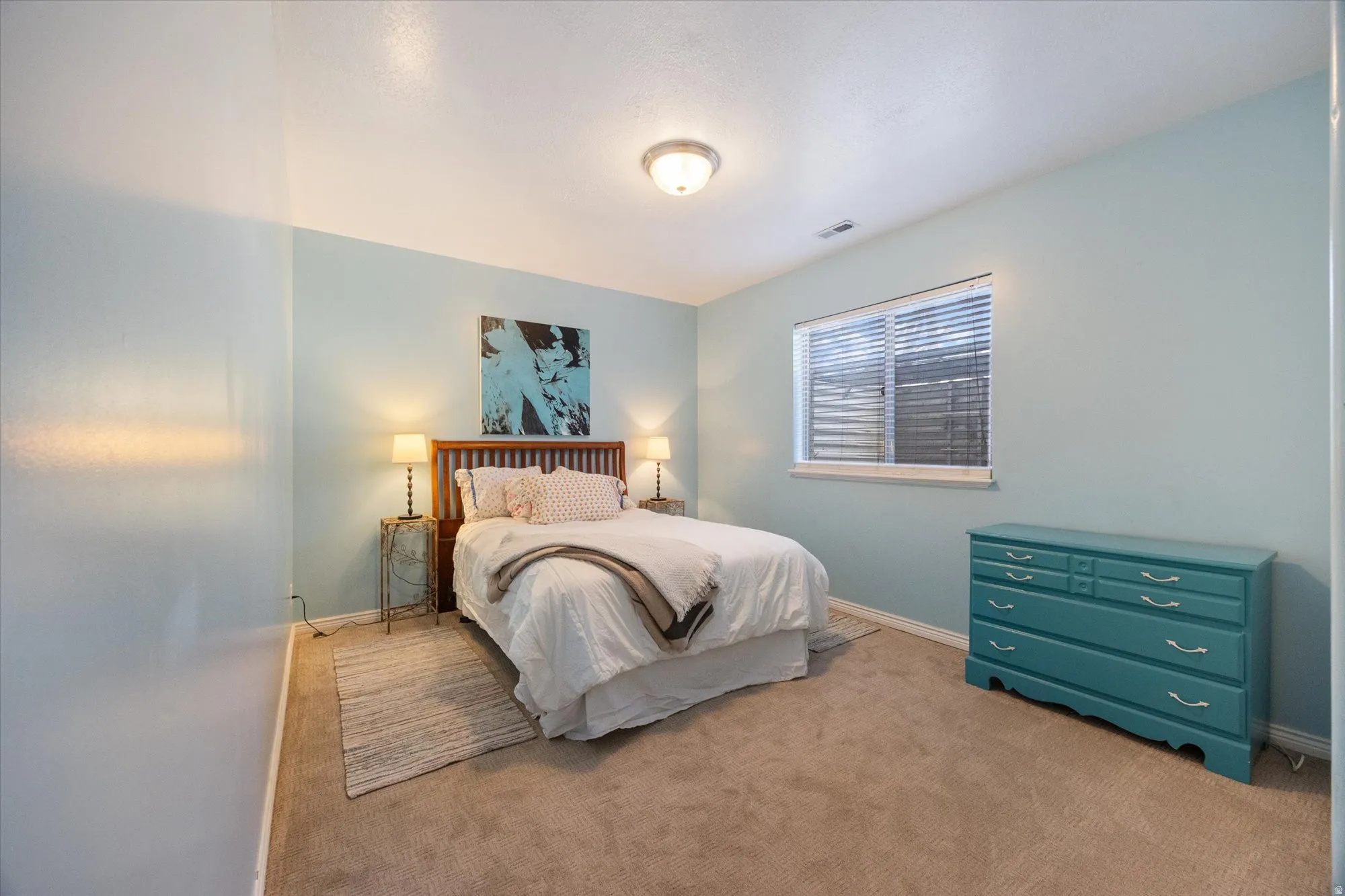 Bedroom with carpet floors and baseboards
