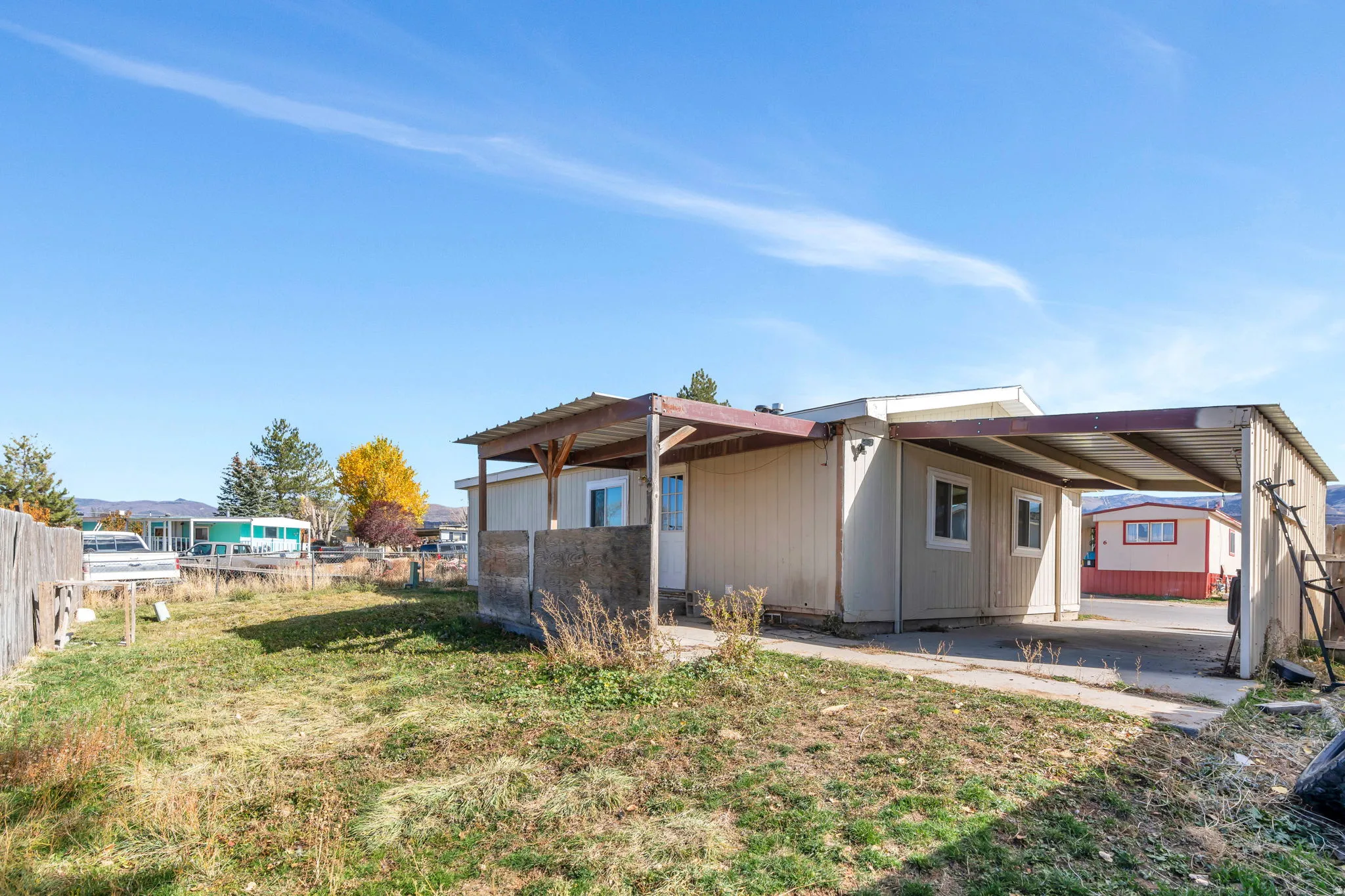 Back of house featuring a carport