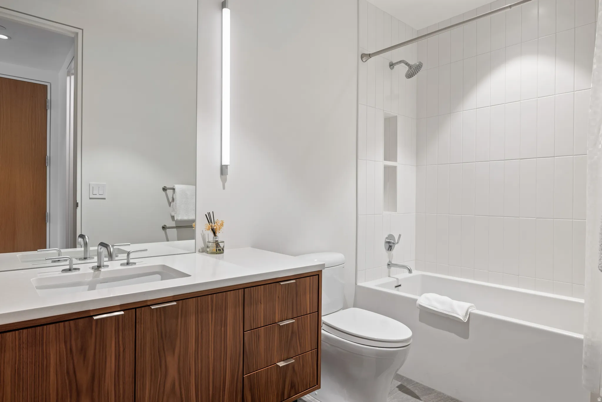Bathroom featuring vanity and shower / tub combo with curtain