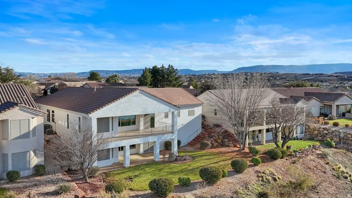 Aerial perspective of suburban area with a mountainous background