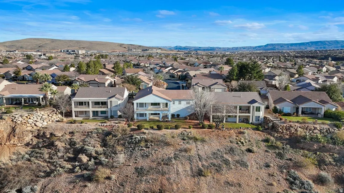 Aerial view of residential area with a mountainous background