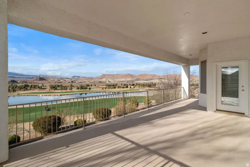 Deck featuring a patio and a water and mountain view