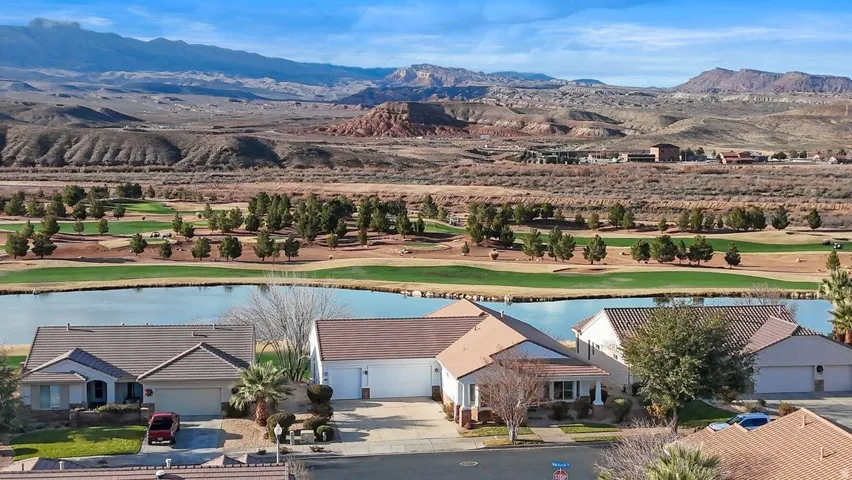 Bird's eye view of a water and mountain view and a local golf course