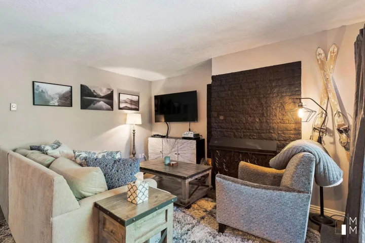Living room featuring a textured ceiling