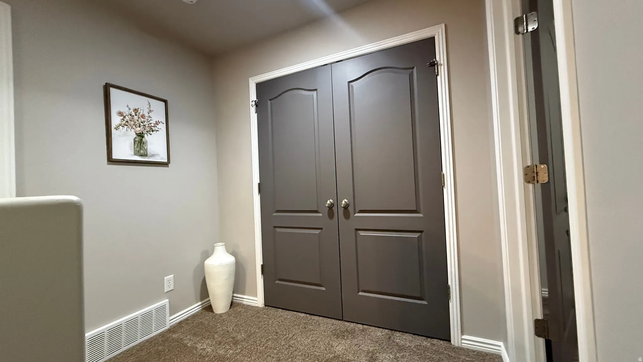 Bedroom with a closet and carpet