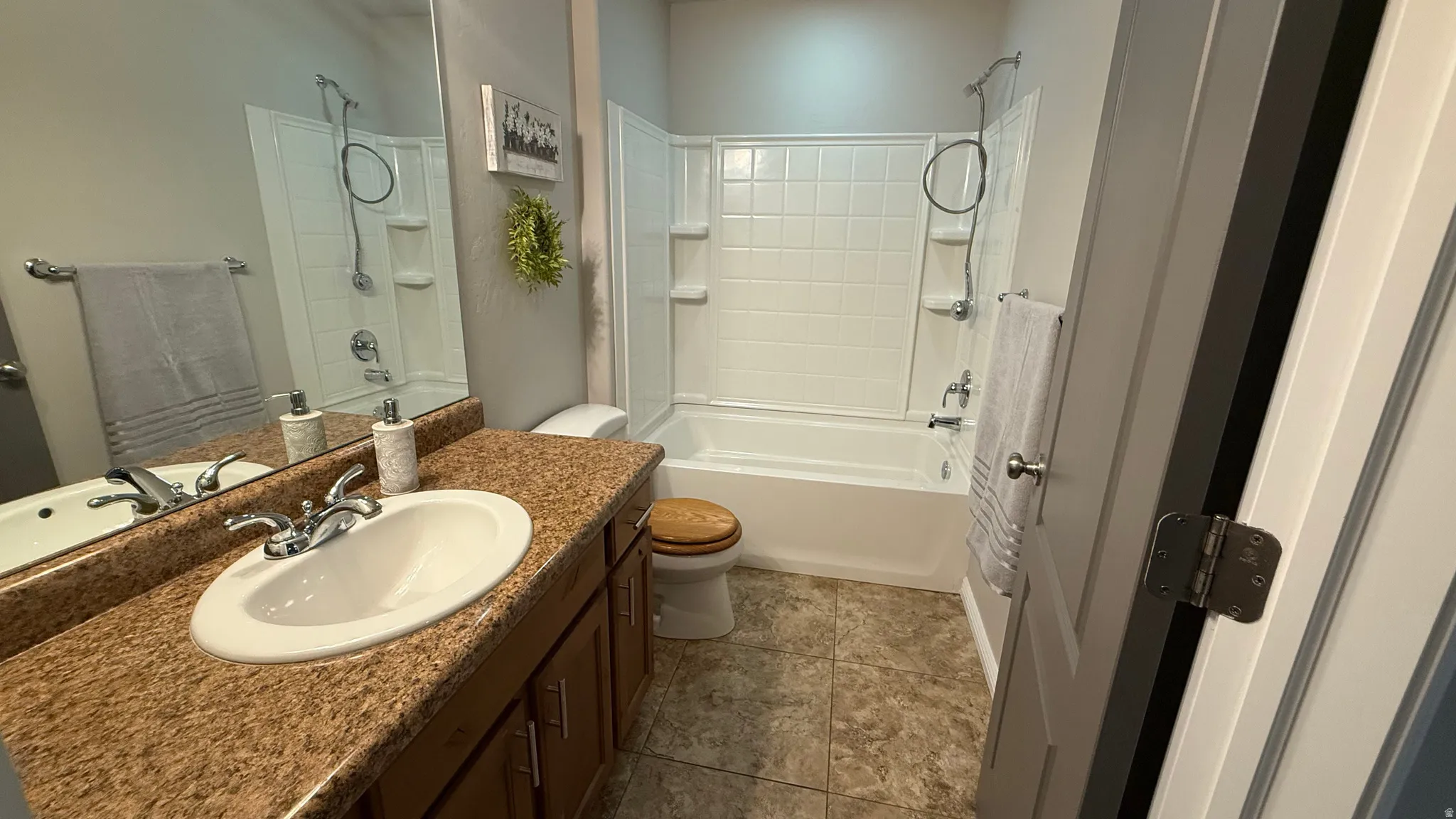 Full bath with vanity and bathing tub / shower combination