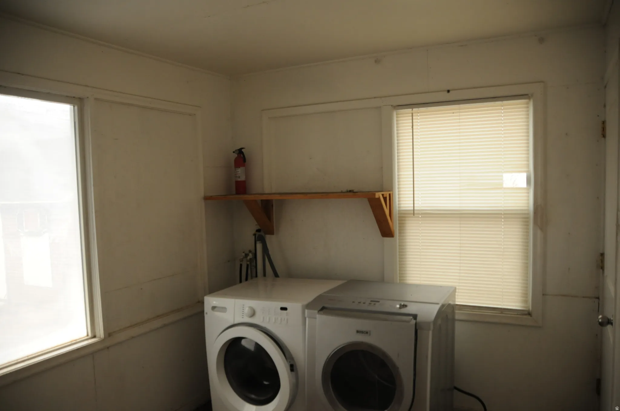 Laundry room featuring washer and clothes dryer