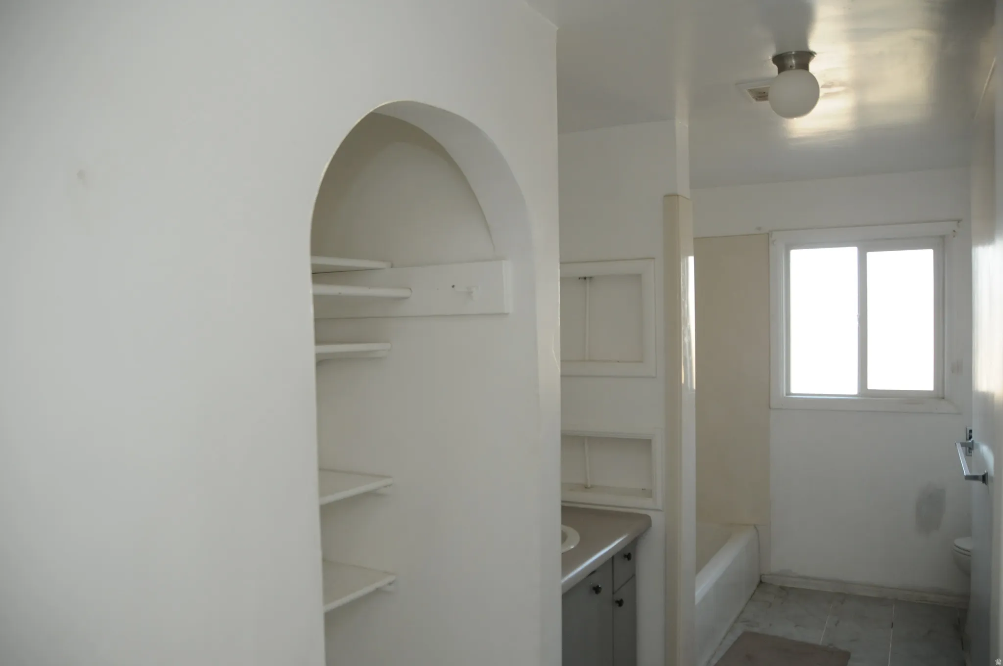 Bathroom featuring vanity and bathtub / shower combination