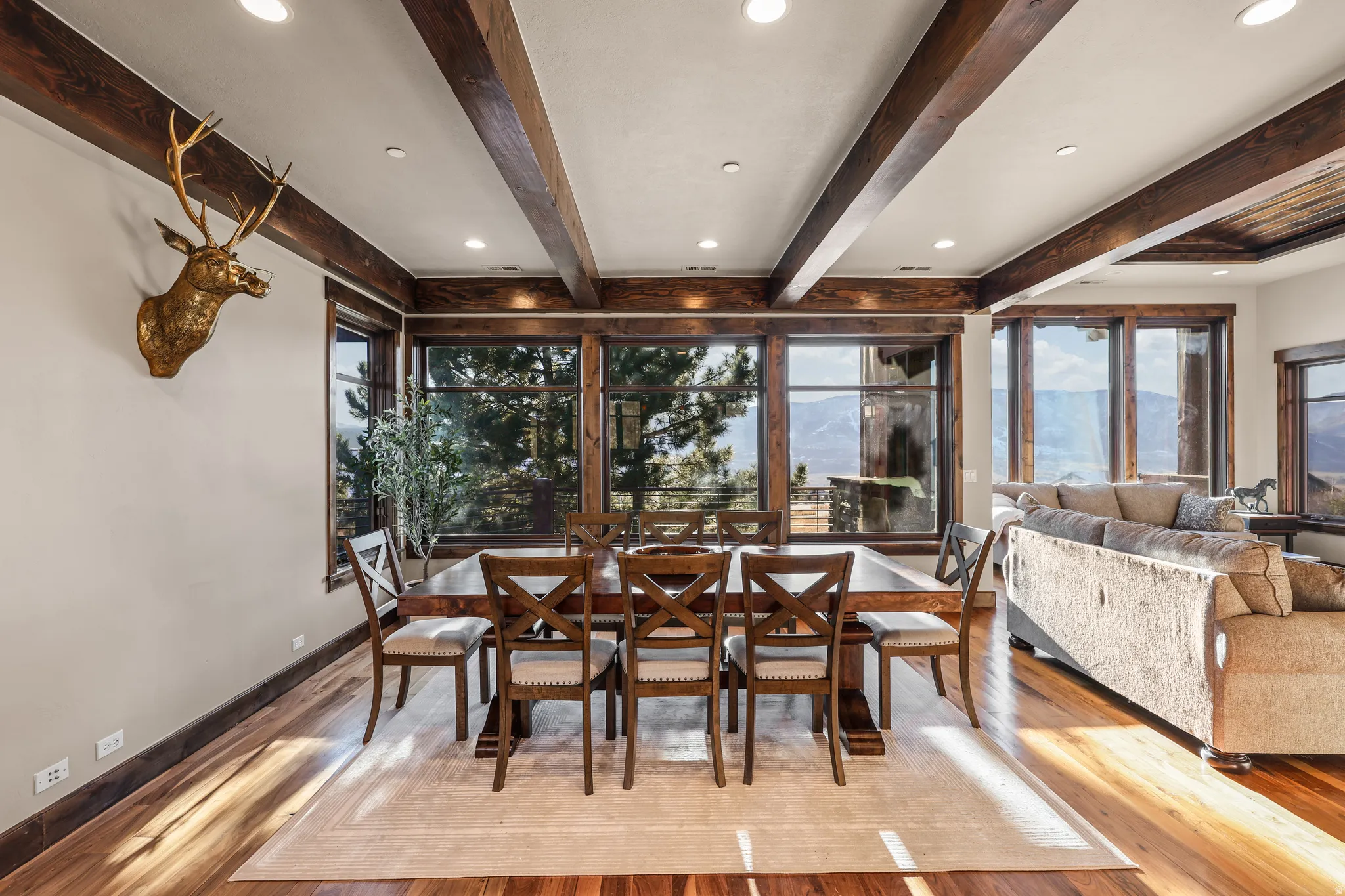 Dining area featuring recessed lighting, light wood-style flooring, and beam ceiling