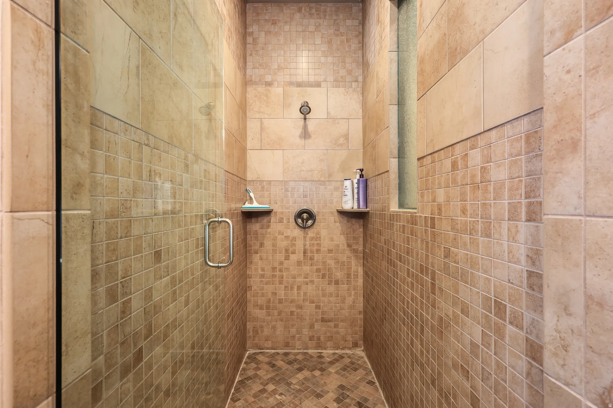 Bathroom with a tile shower