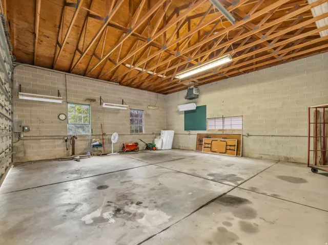 Garage featuring a heating unit