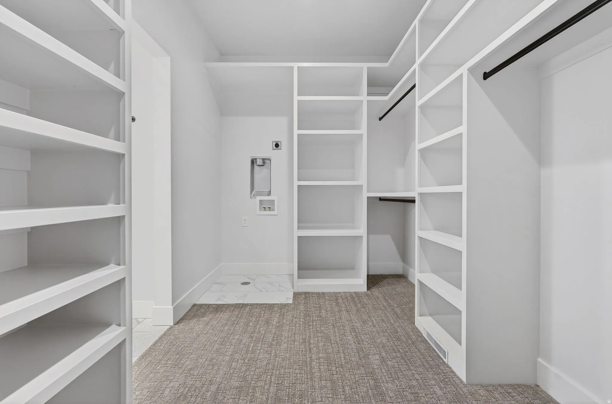 Huge ensuite Spacious closet with washer dryer stackable hookups,  light colored carpet