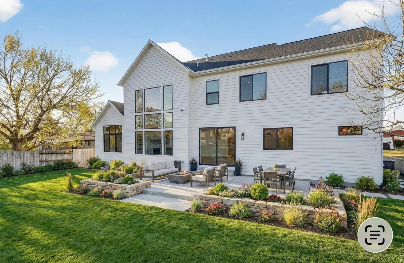 VIRTUALLY STAGED Rear view of house featuring an outdoor living space and a patio