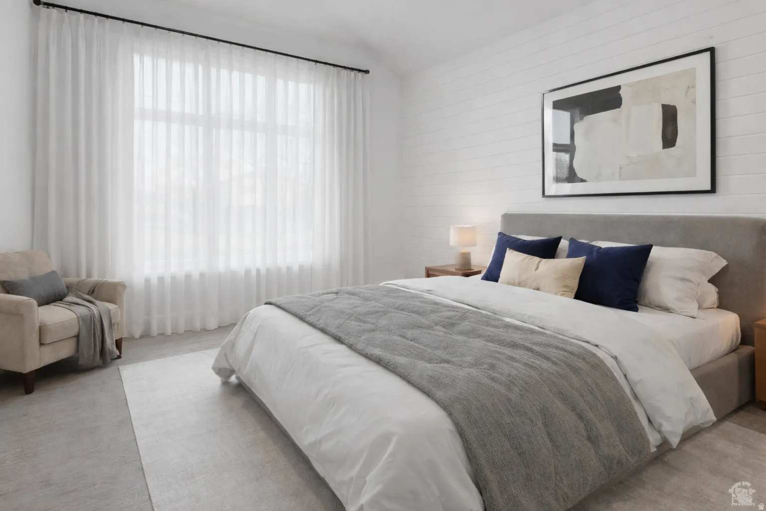 Bedroom featuring lofted ceiling and carpet