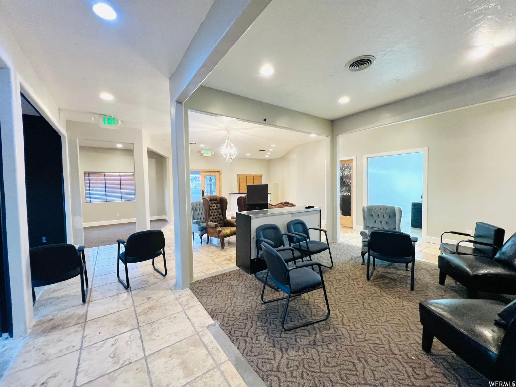 Living room featuring a chandelier and recessed lighting