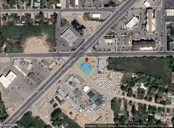 Aerial map of property and surrounding area featuring property parcel outlined