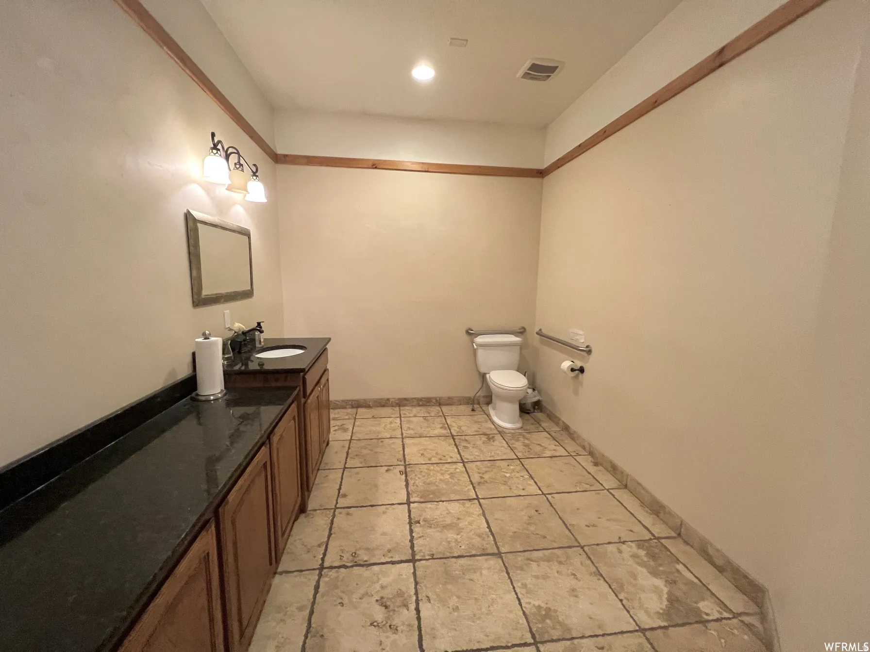 Bathroom featuring toilet and vanity
