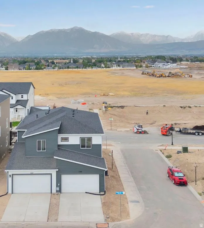 View of subject property with a mountain backdrop