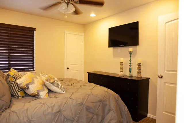 Bedroom featuring ceiling fan, carpet flooring, and recessed lighting