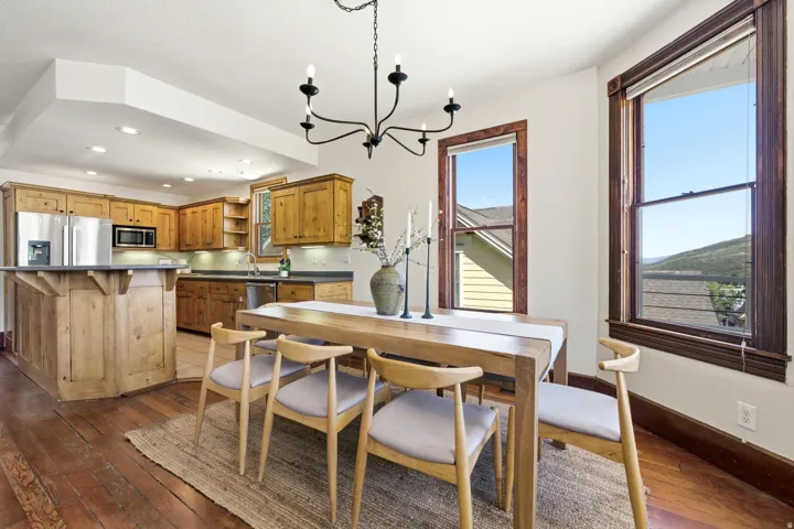 Open concept kitchen and dining area with wood-finish flooring