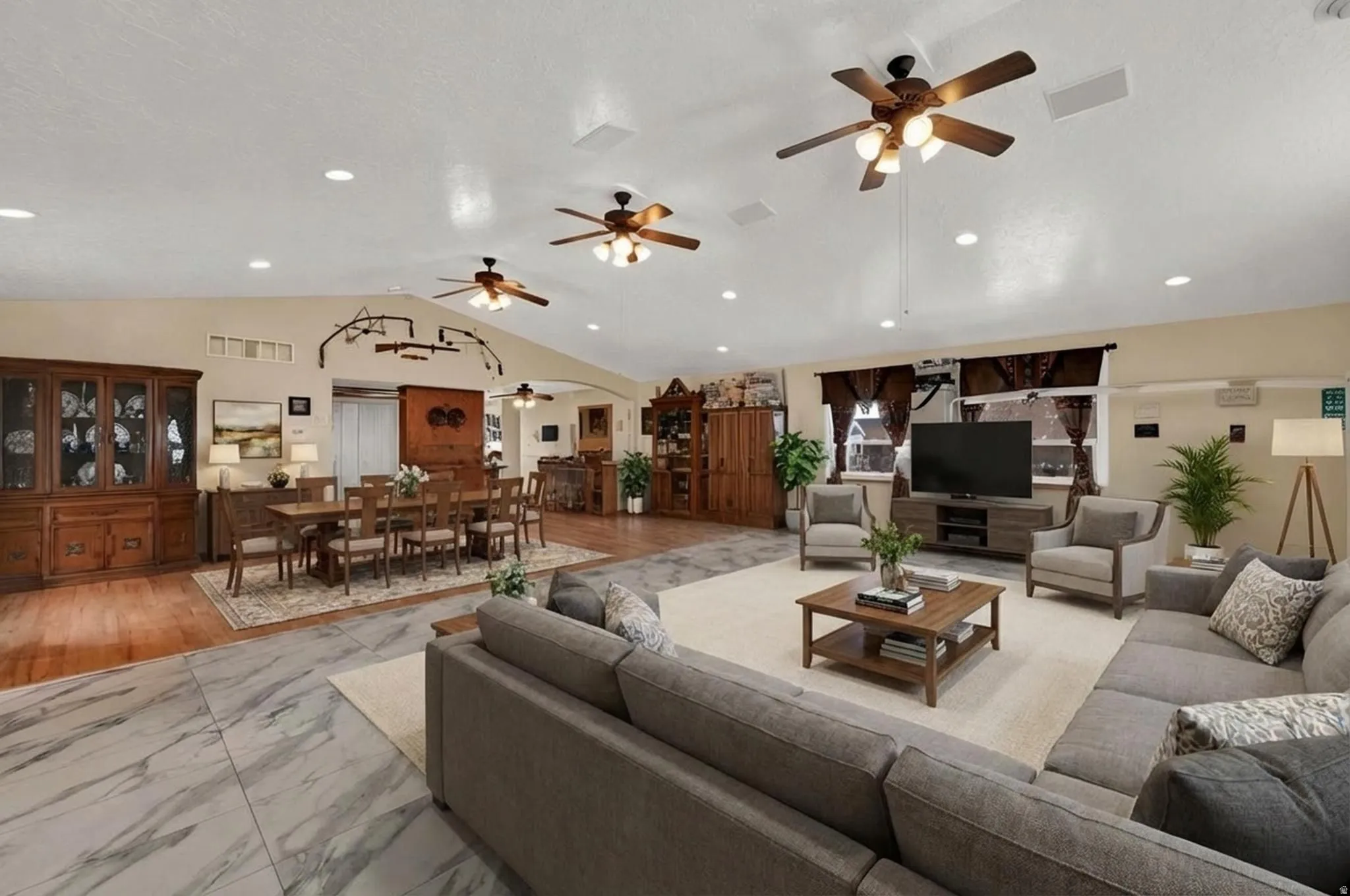 Virtually staged living room open to dining and kitchen areas