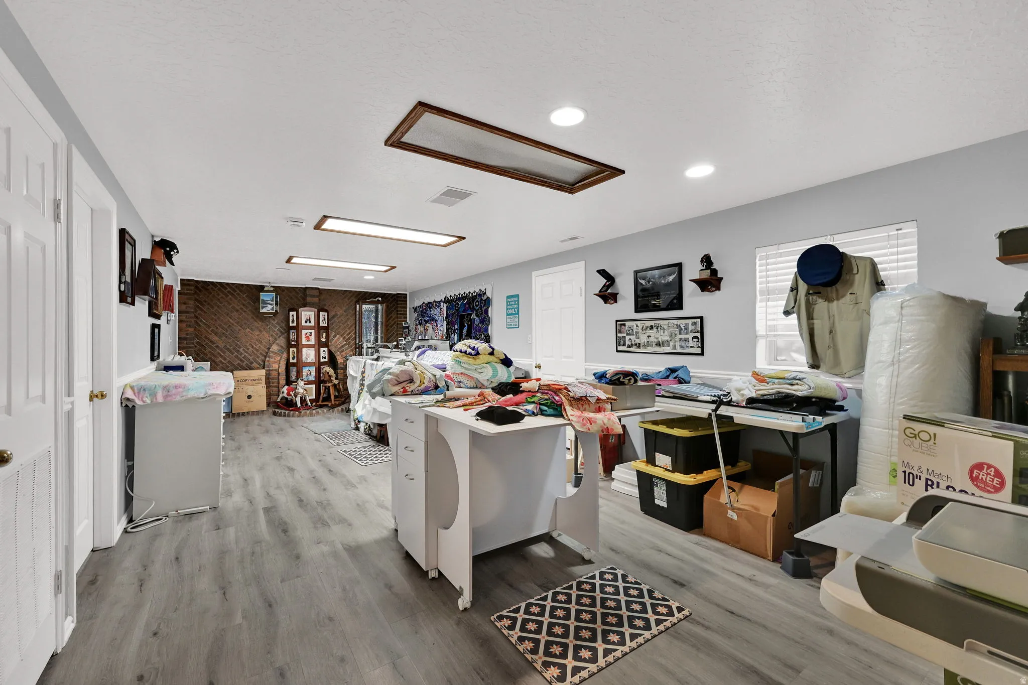 Rec room/ family room in basement currently being used as a craft room