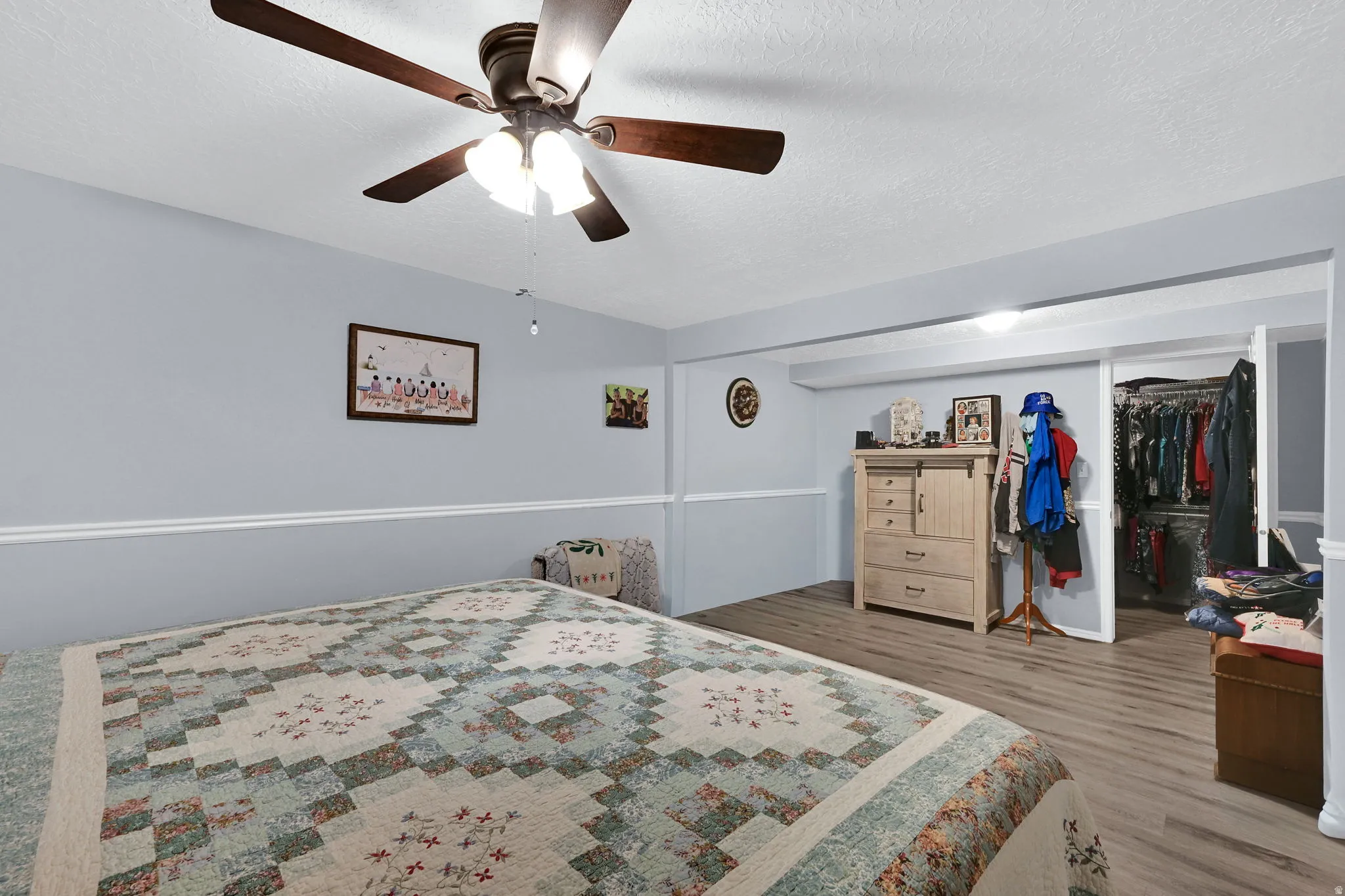 Bedroom in basement converted from 2 bedrooms into 1 large bedroom with a walk-in closet