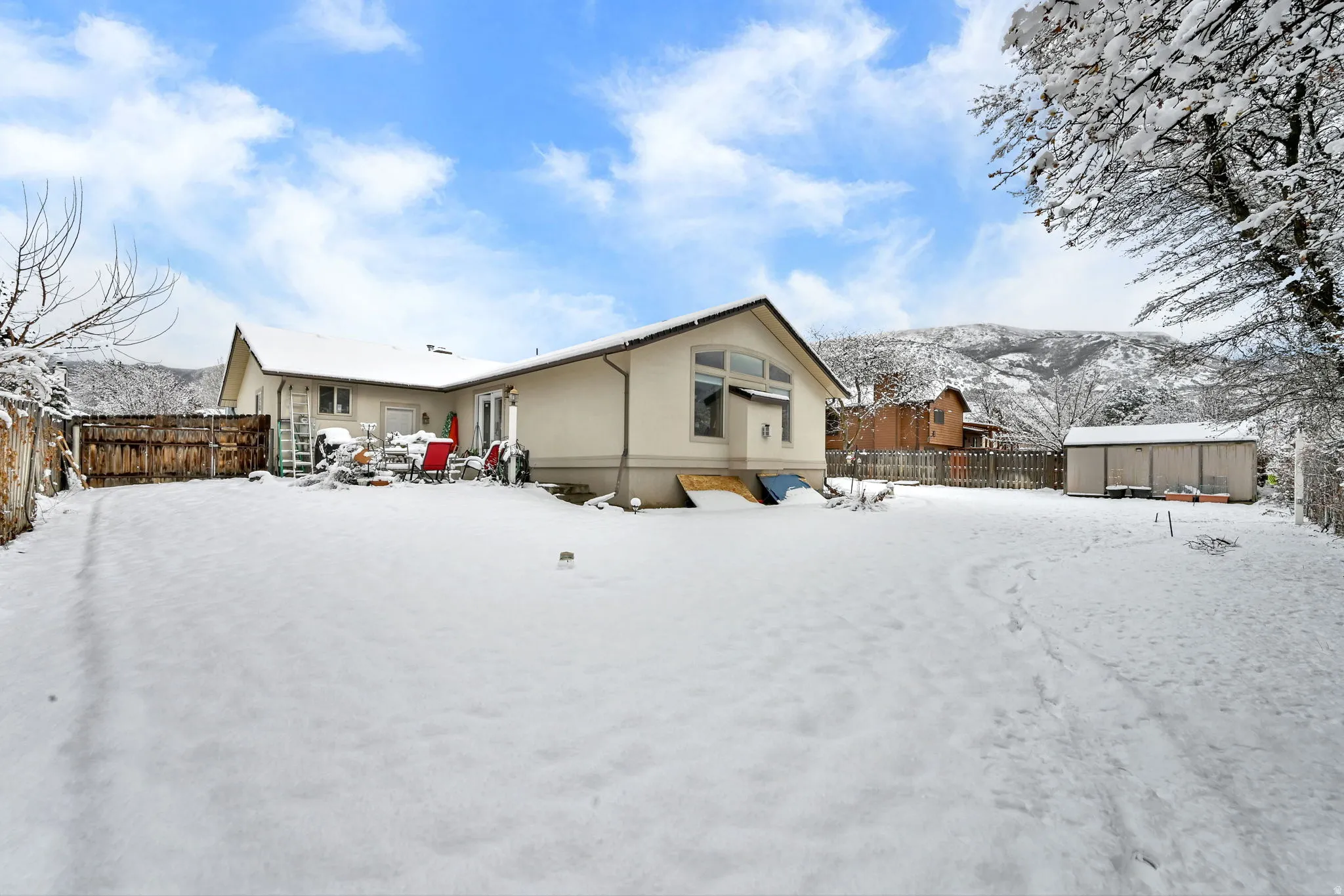 Fully fenced backyard with mountain views