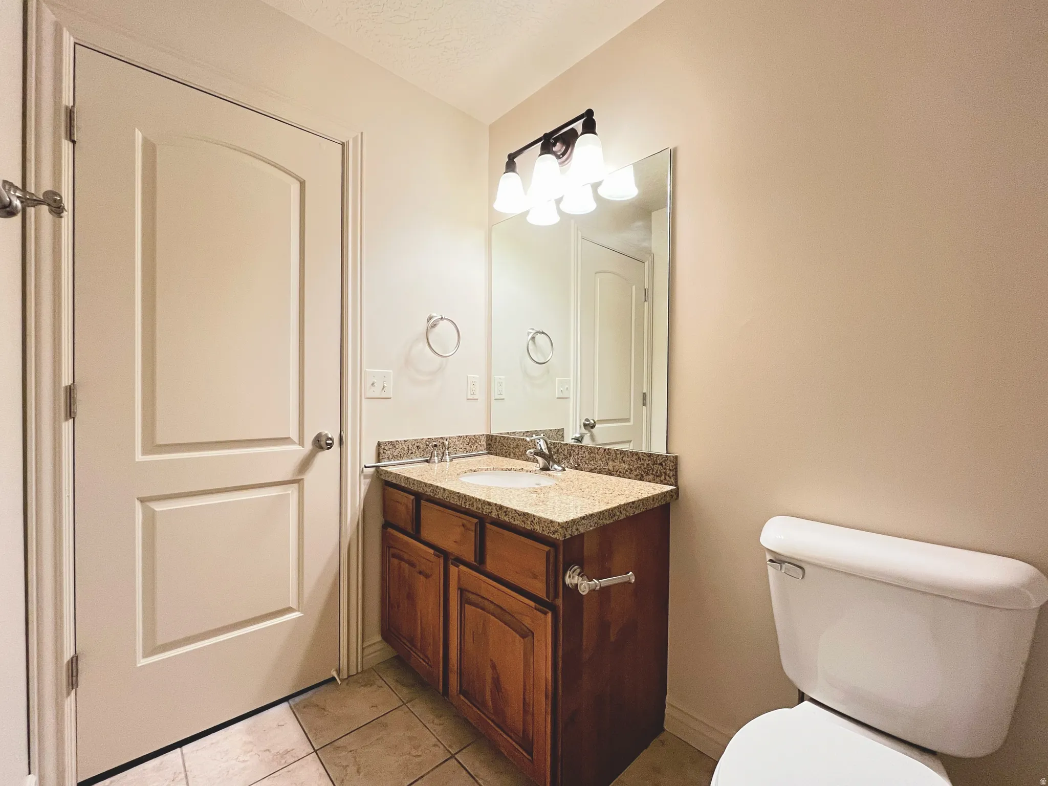 Bathroom with vanity and light tile patterned floors