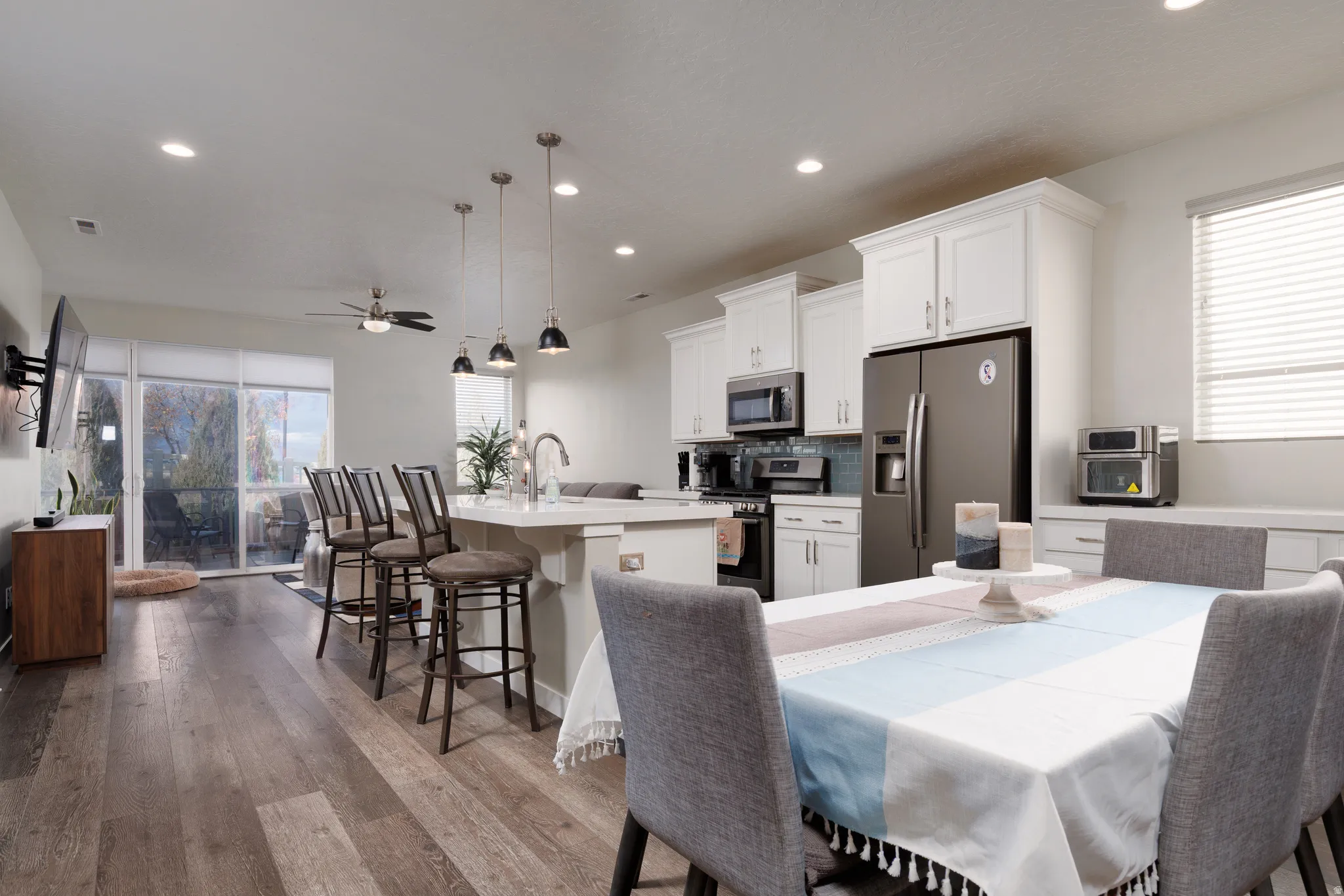 Dining room area featuring recessed lighting, ceiling fan, and light wood-type flooring