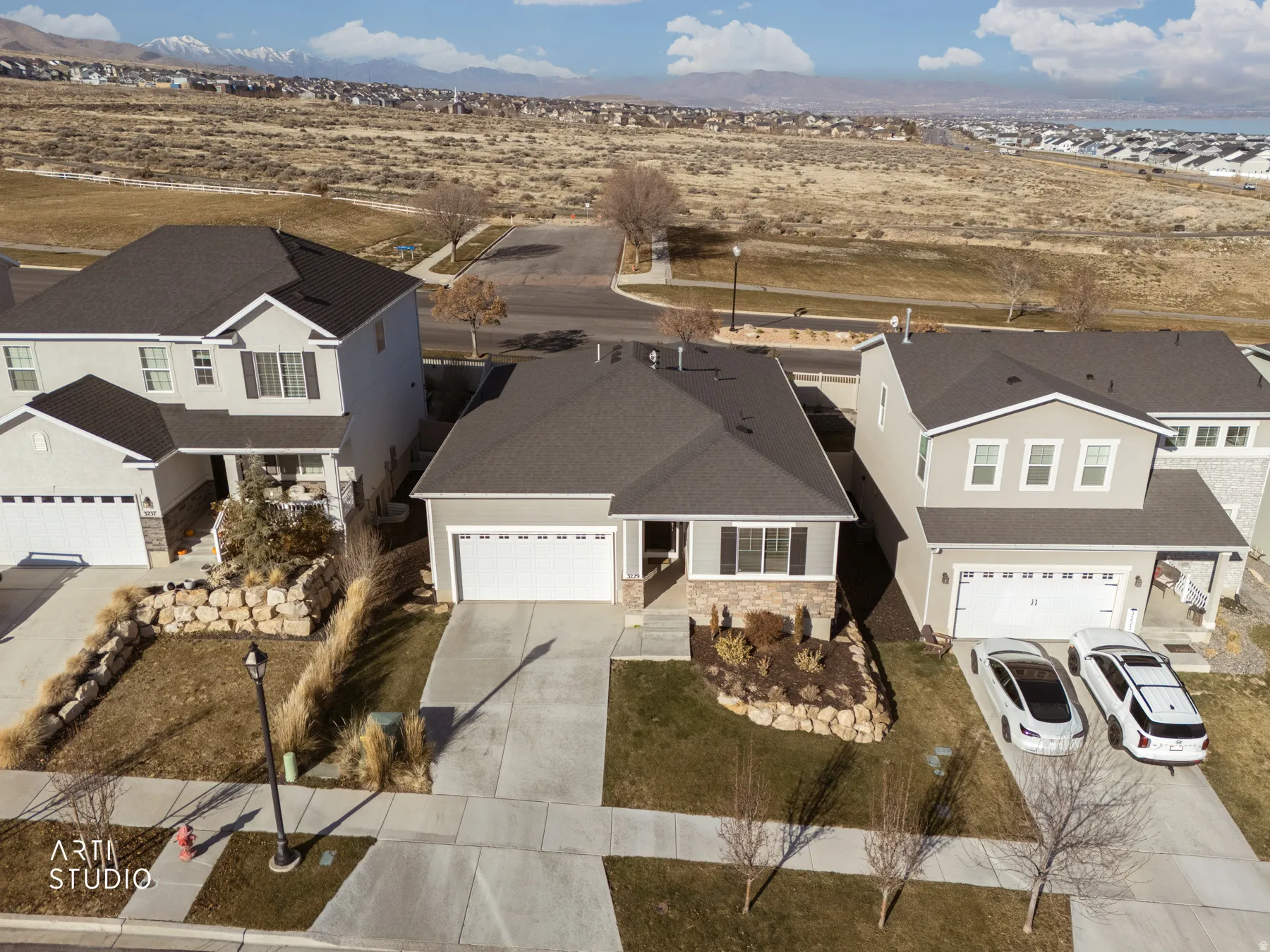 Aerial view of residential area and fields beyond