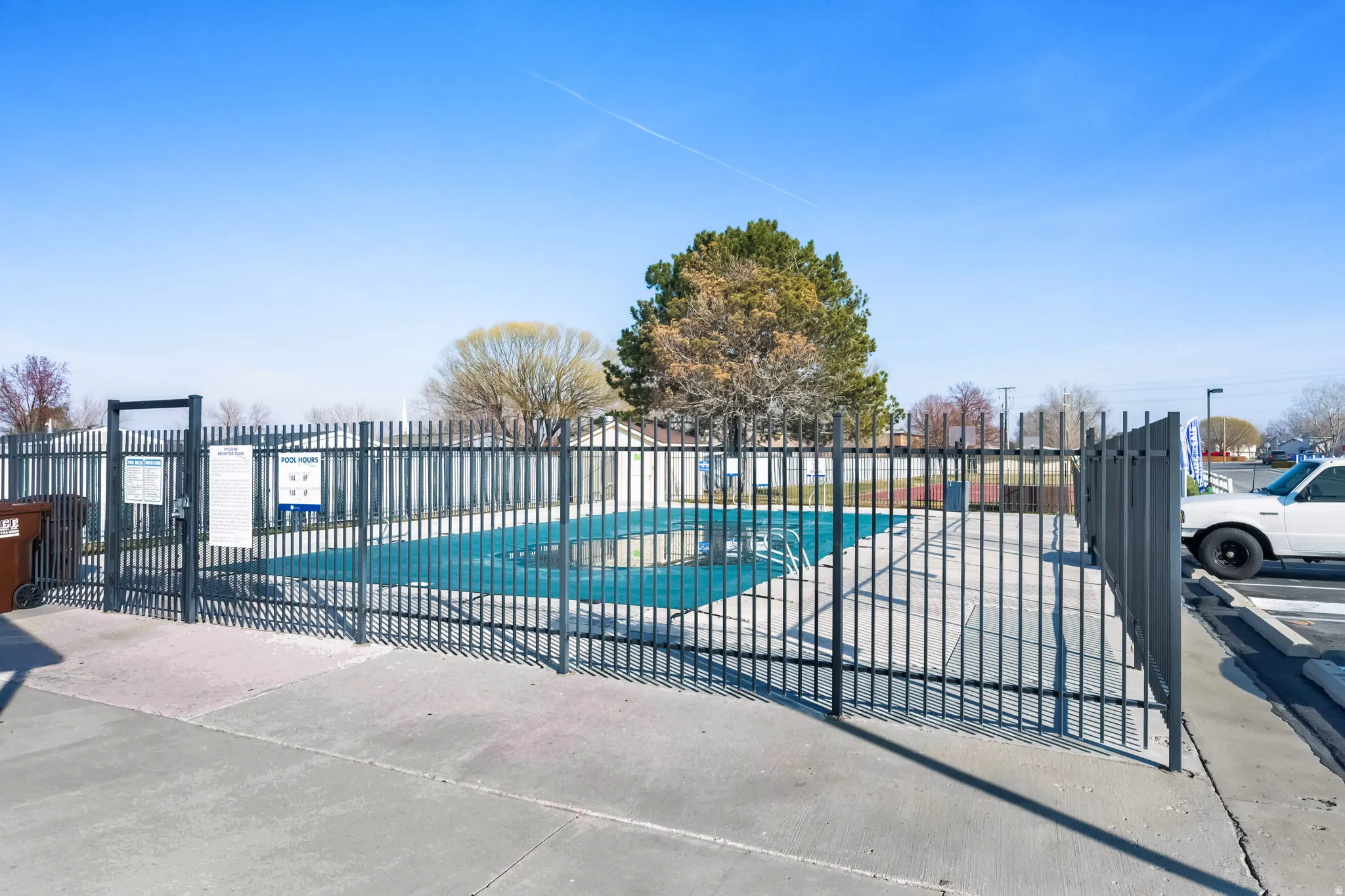 Community pool with a patio area