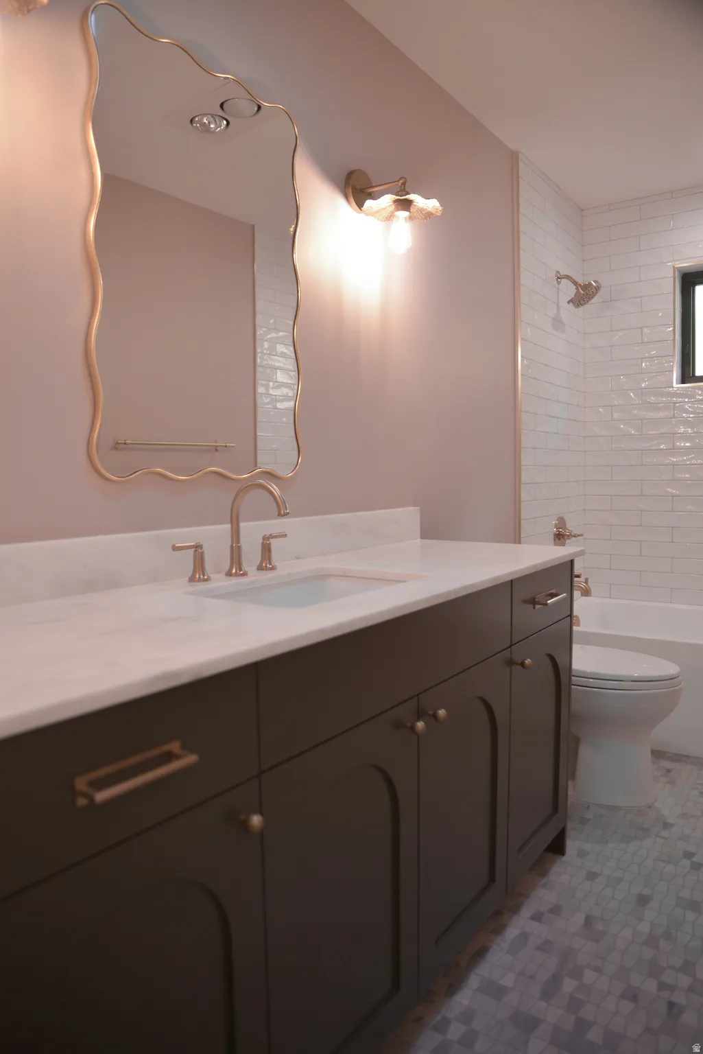 Full bath with vanity, washtub / shower combination, and light tile patterned flooring
