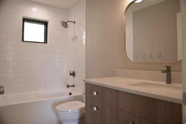 Full bathroom with vanity and tub / shower combination
