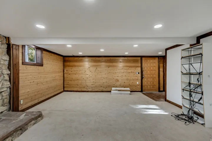 Below grade area with wood walls