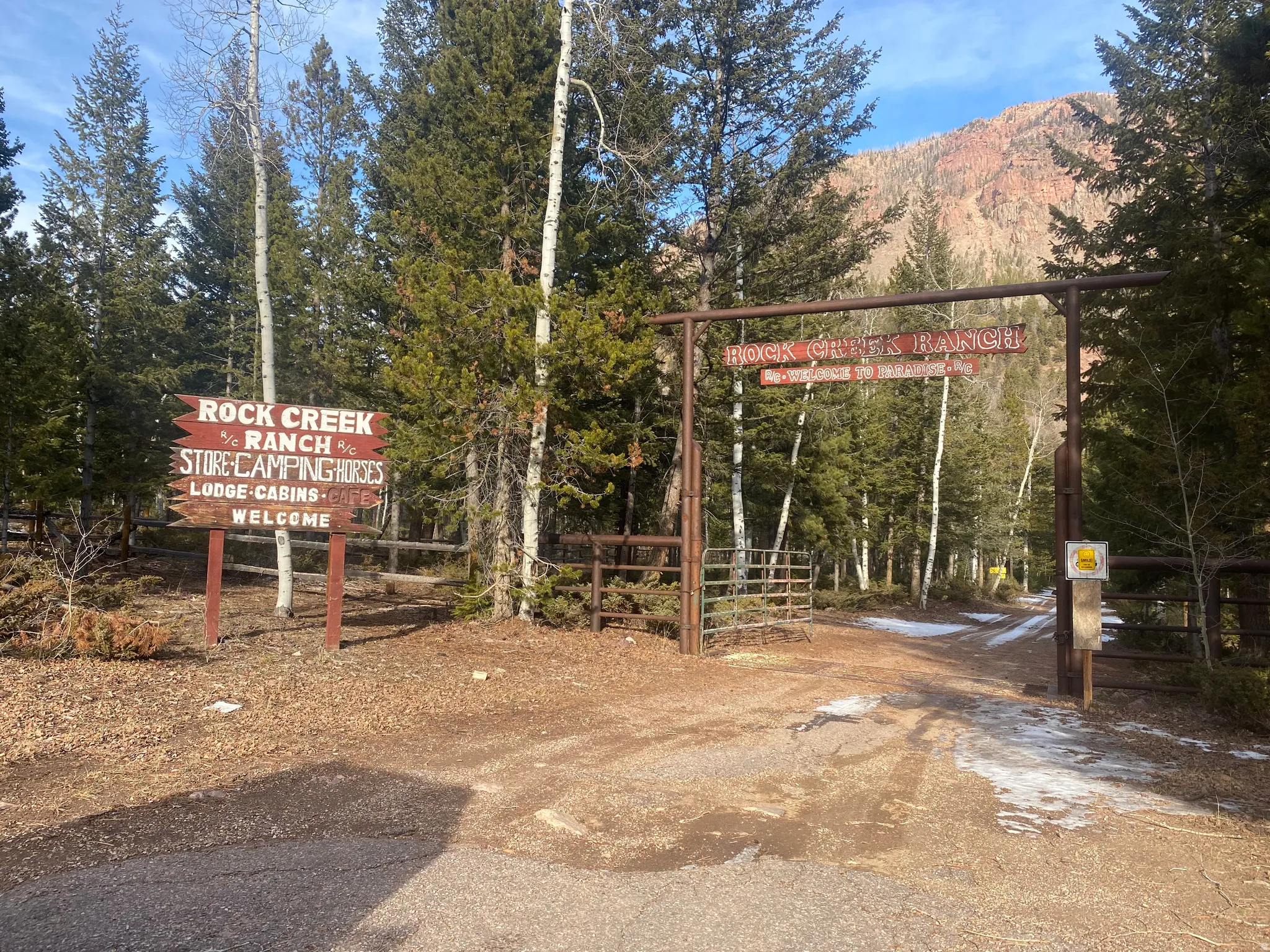 View of dirt / gravel road with a gate