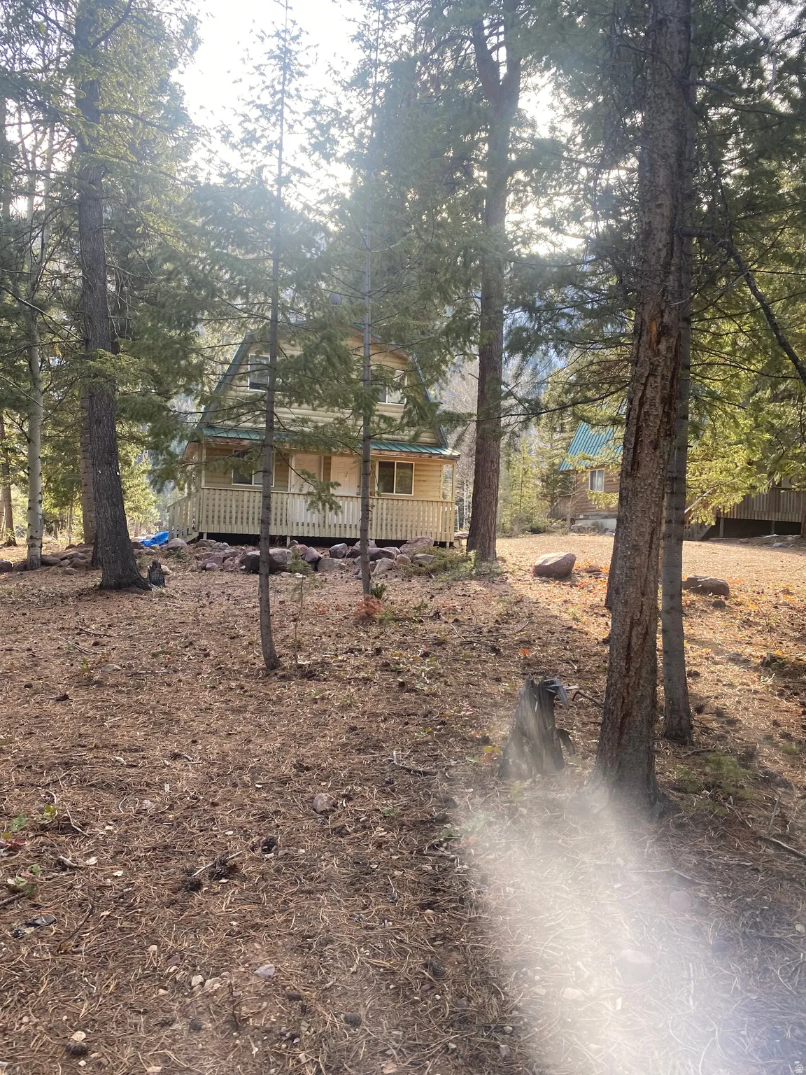 View of front of property with a wooden deck
