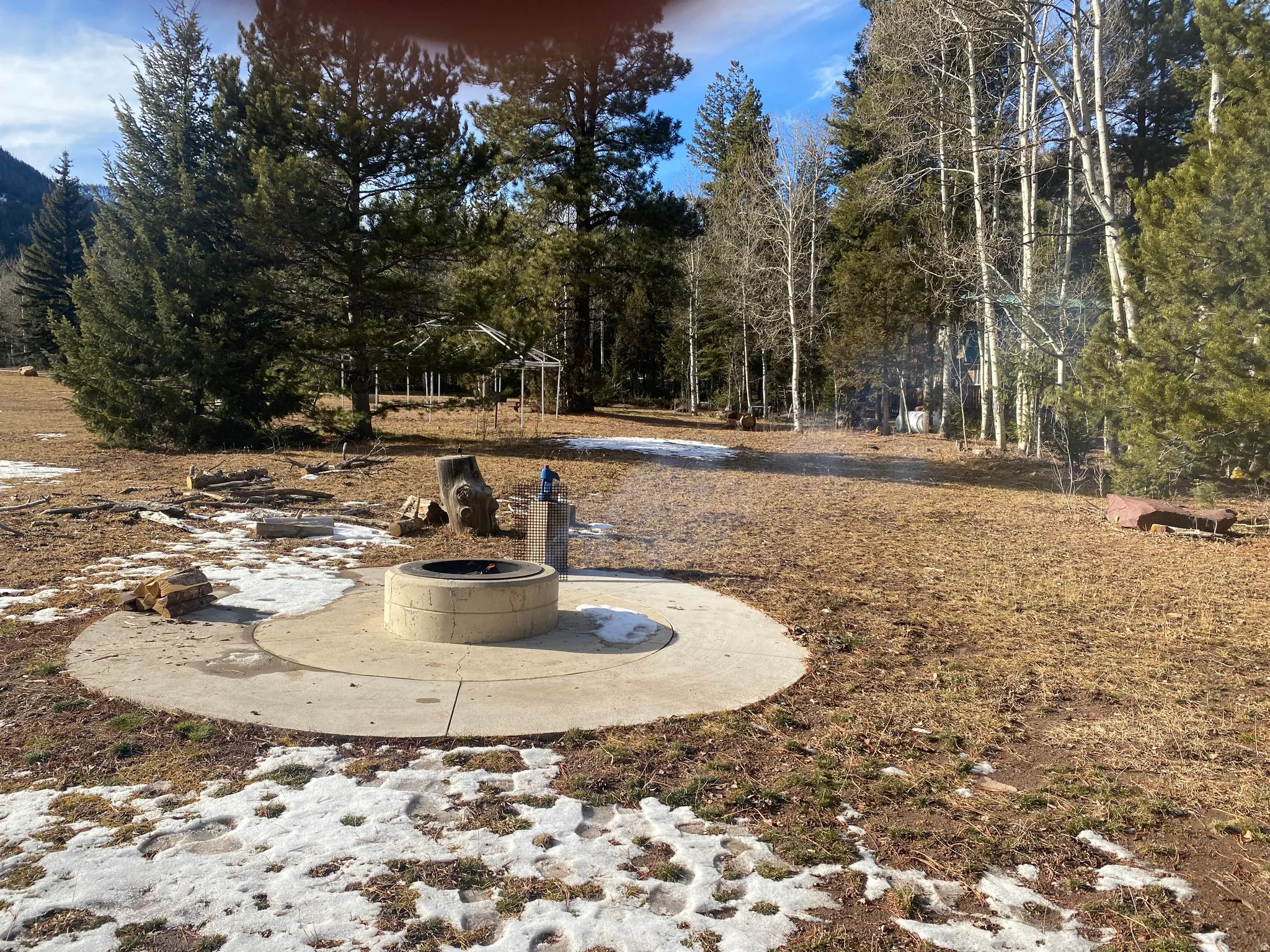 View of yard featuring a patio and a fire pit