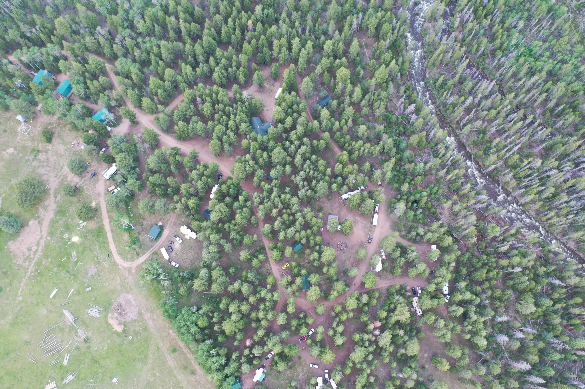 Aerial view of property and surrounding area featuring property parcel outlined