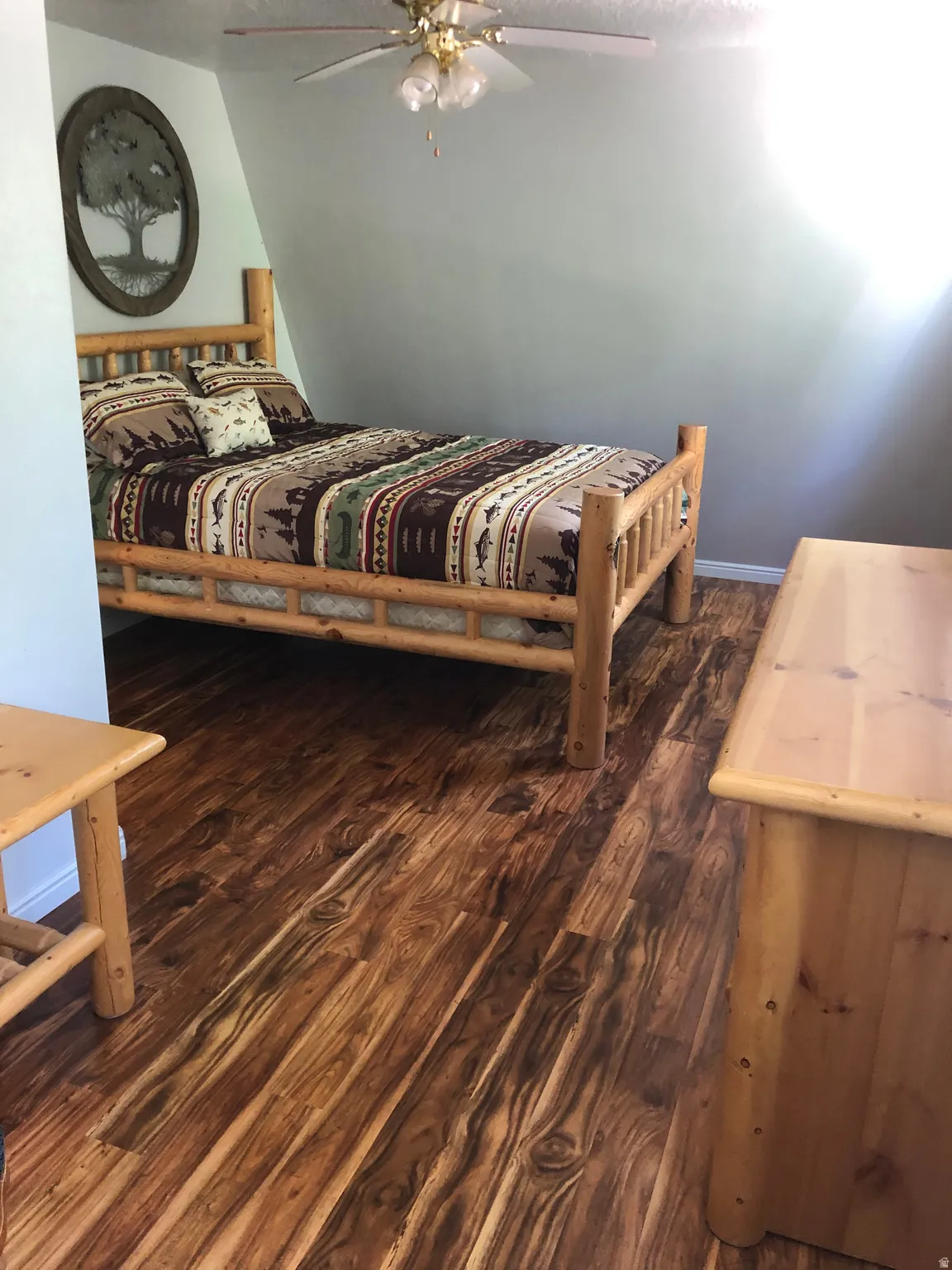 Bedroom featuring dark wood-type flooring and a ceiling fan