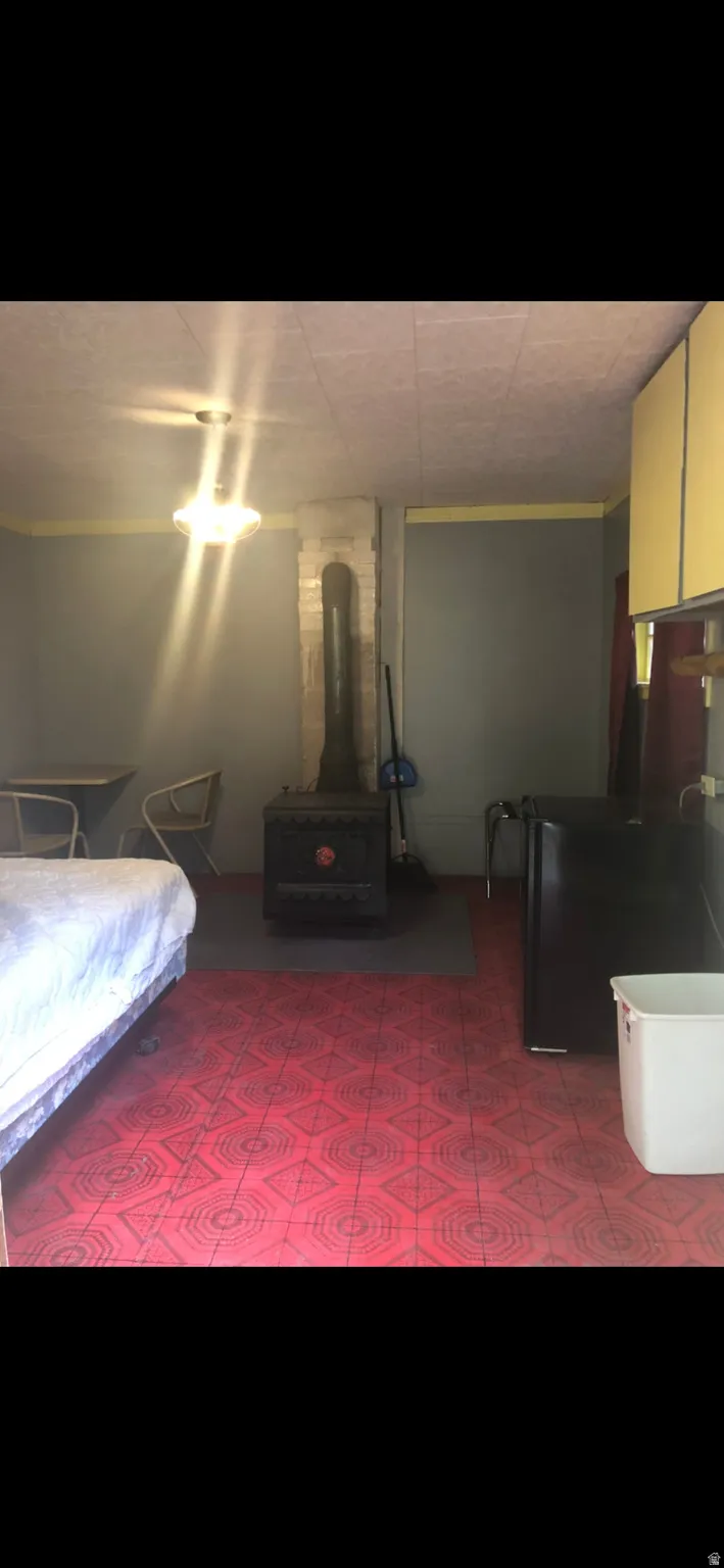 Bedroom with a wood stove