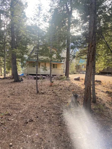 View of front of property with a wooden deck