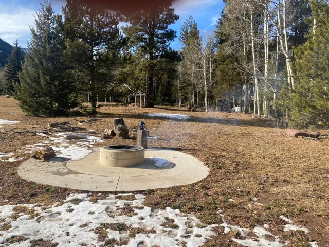View of yard featuring a patio and a fire pit