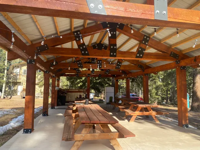 View of community featuring a patio area and outdoor dining area