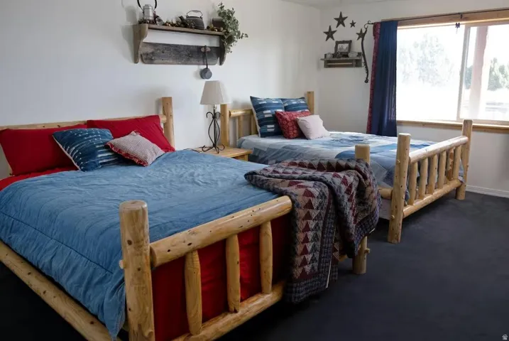 Bedroom featuring dark carpet