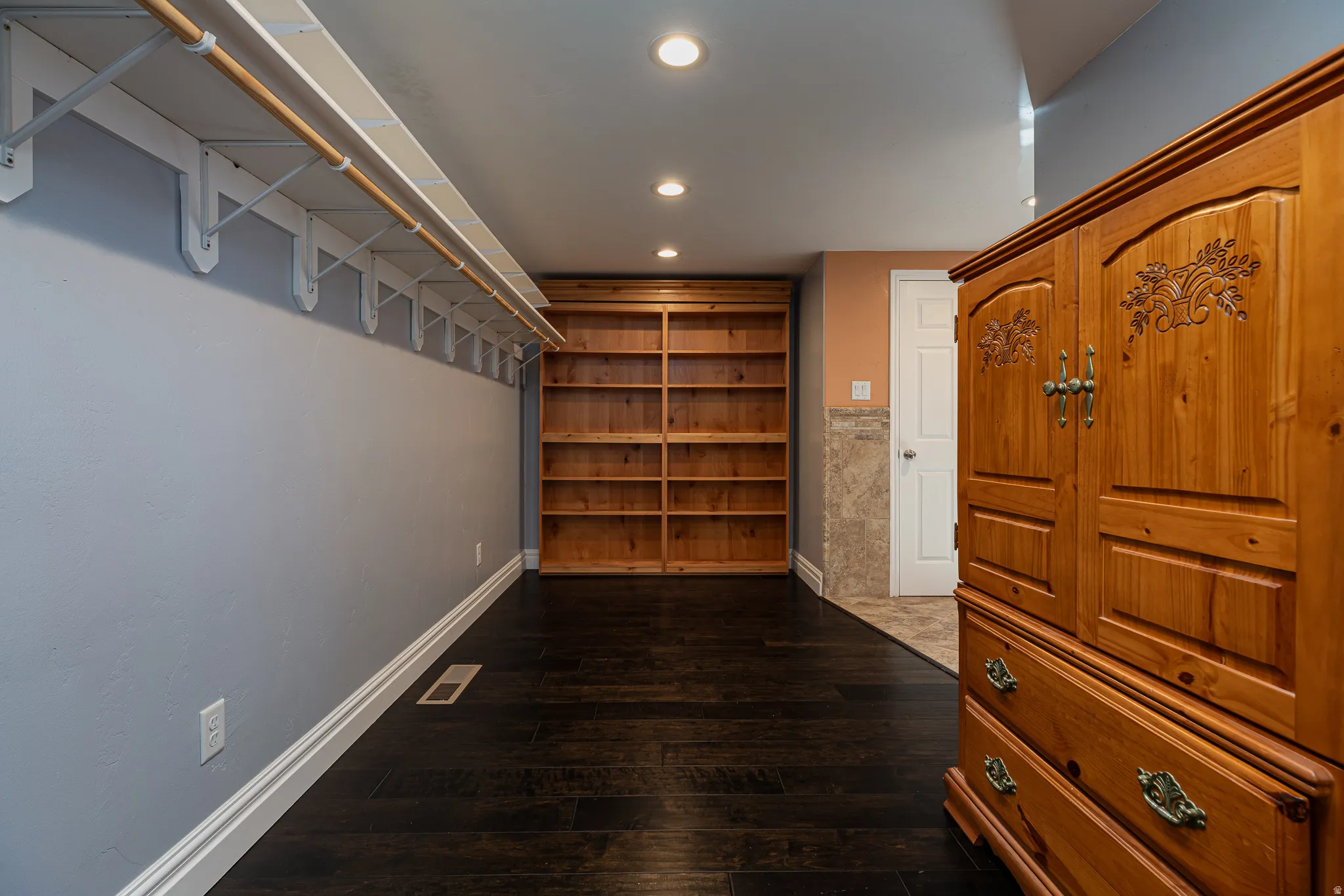 Primary Closet with Retractable Bookshelf