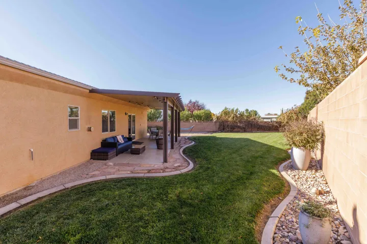 Fenced backyard with a patio area and an outdoor living space